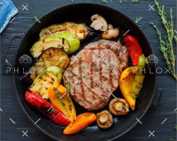 demo-attachment-225-grilled-beef-steak-on-dark-wooden-table-P4NLM25